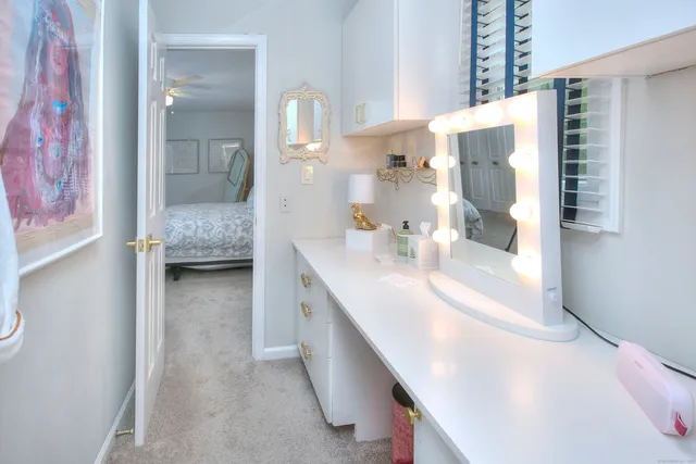 a en suite bathroom with a sink double vanity and mirror