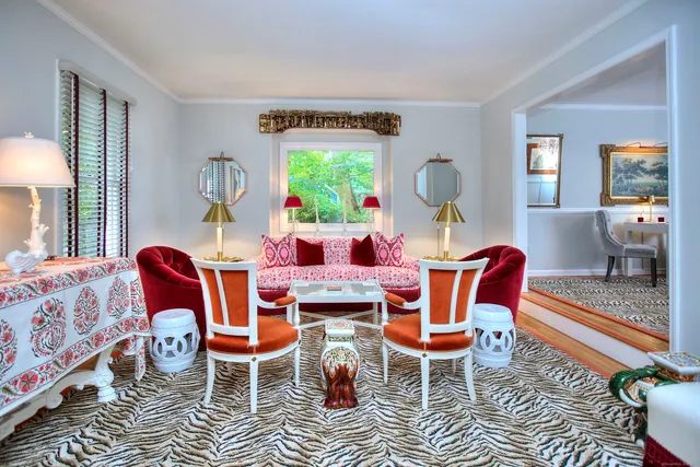 a dining room with furniture and a window