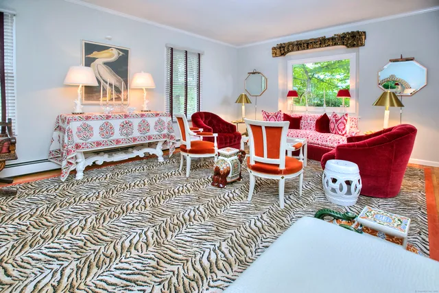 a living room filled with furniture and a table