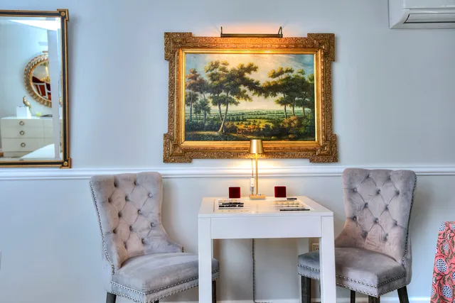 a dining room with furniture and window