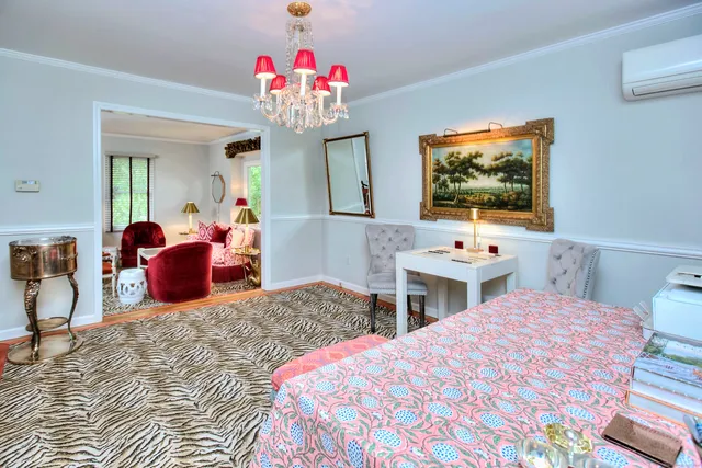 a bedroom with two beds and a flat screen tv