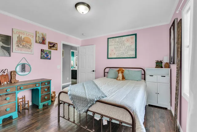 a bedroom with a bed and a table in it