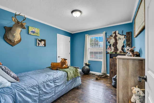 a bedroom with bed and a window