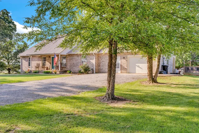 a view of swimming pool with tree s