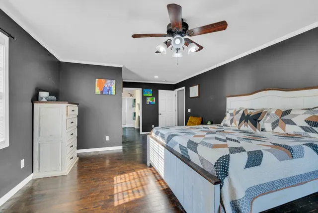 a bed room with a bed and a chandelier