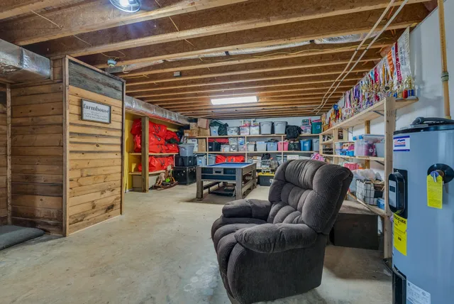 an aerial view of a house with garden space ocean and mountain view in back