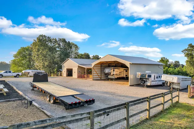 a bathroom with a toilet mirror and vanity