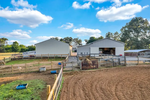a bedroom with a bed and a tv on the dresser