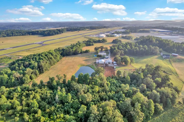 a view of a swimming pool with an outdoor seating