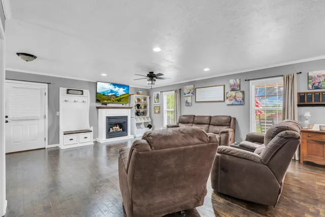 a living room with furniture and a fireplace