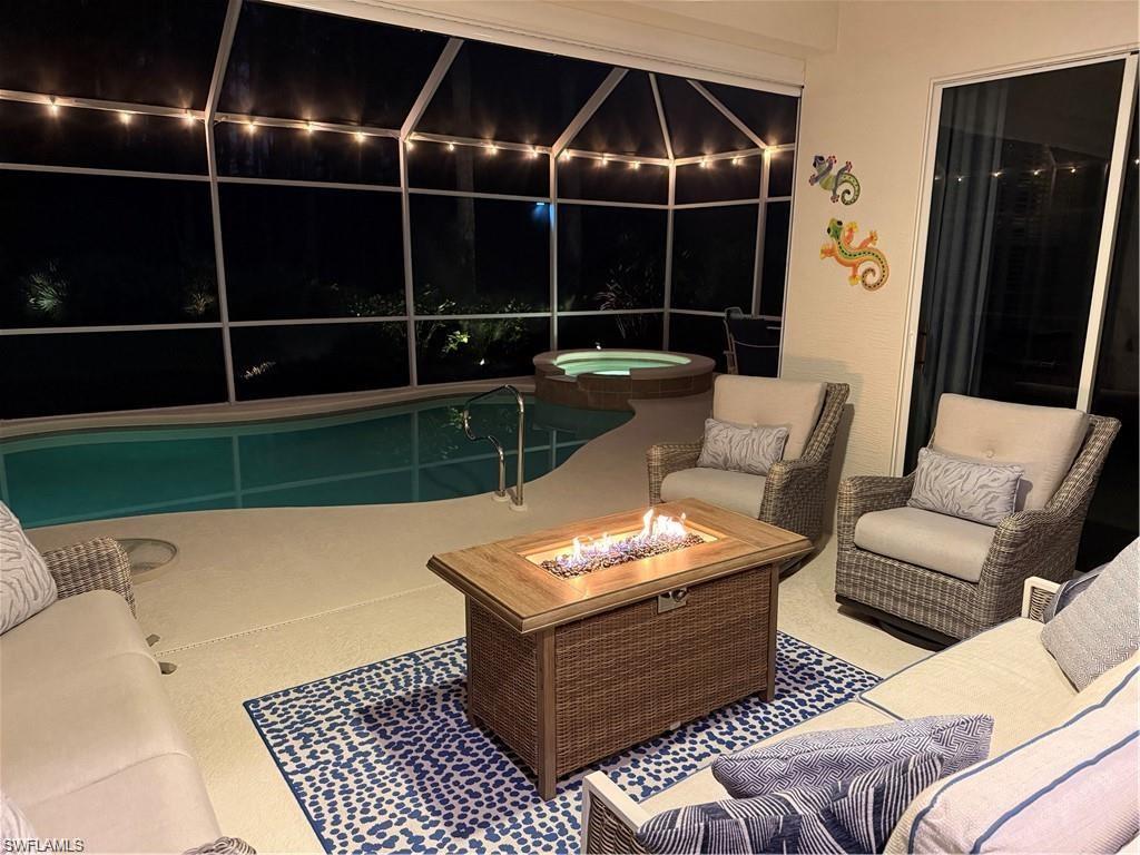20117 Seadale Court Estero, FL 33928 - Photo 25 of 34 Screened outdoor living area with a built-in pool and integrated spa