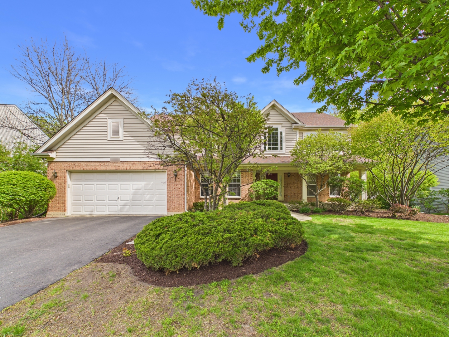 7486 Abbey Road Gurnee, IL 60031 - Photo 1 of 35 front view of a house with a garden