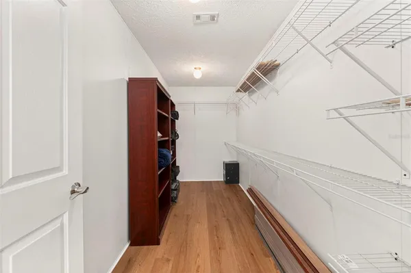 a spacious bathroom with a tub sink and mirror