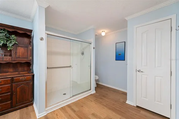 a bedroom with a bed and a lamp