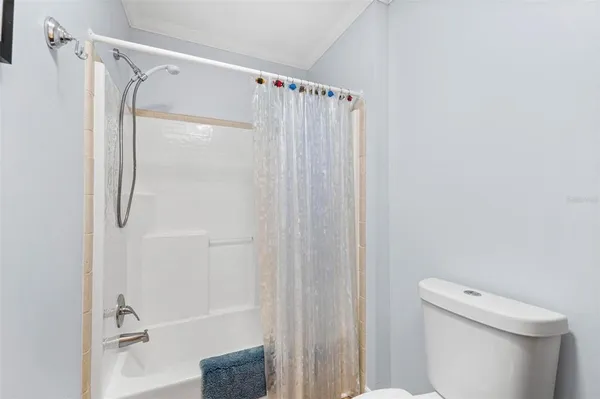 a view of a chairs and table in patio with a small yard