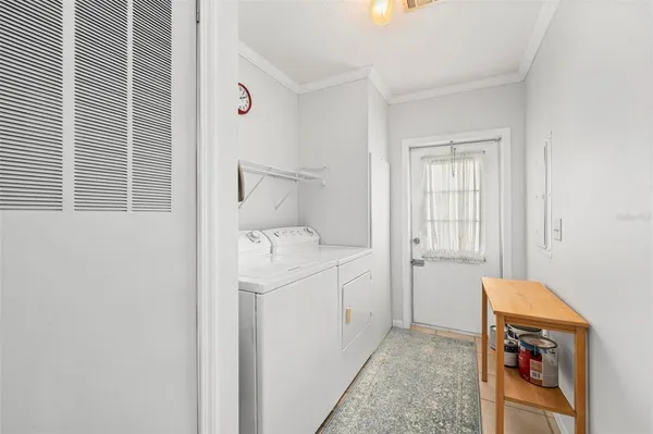 a view of a porch with chairs and wooden floor