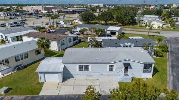 a view of a house with a yard and garage