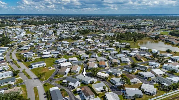 an aerial view of a house with a swimming pool yard and outdoor seating