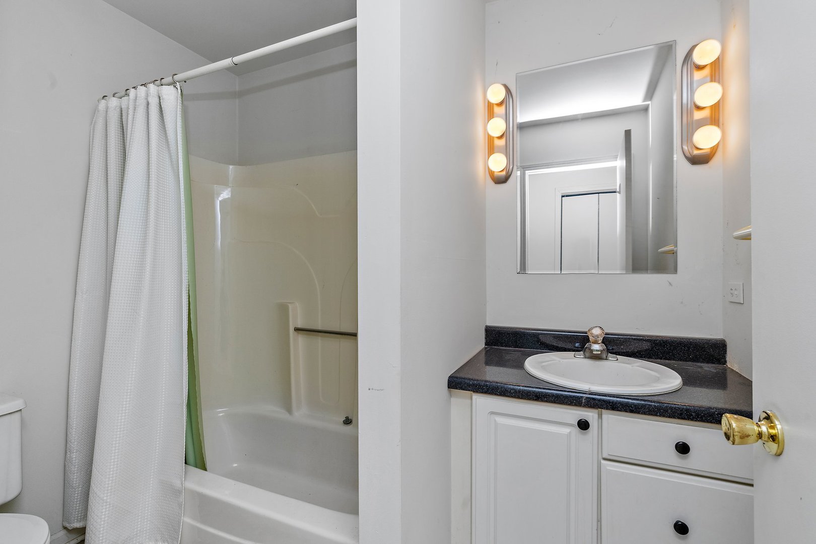 18707 Stevens Road Marengo, IL 60152 - Photo 16 of 35 a bathroom with a sink and a mirror