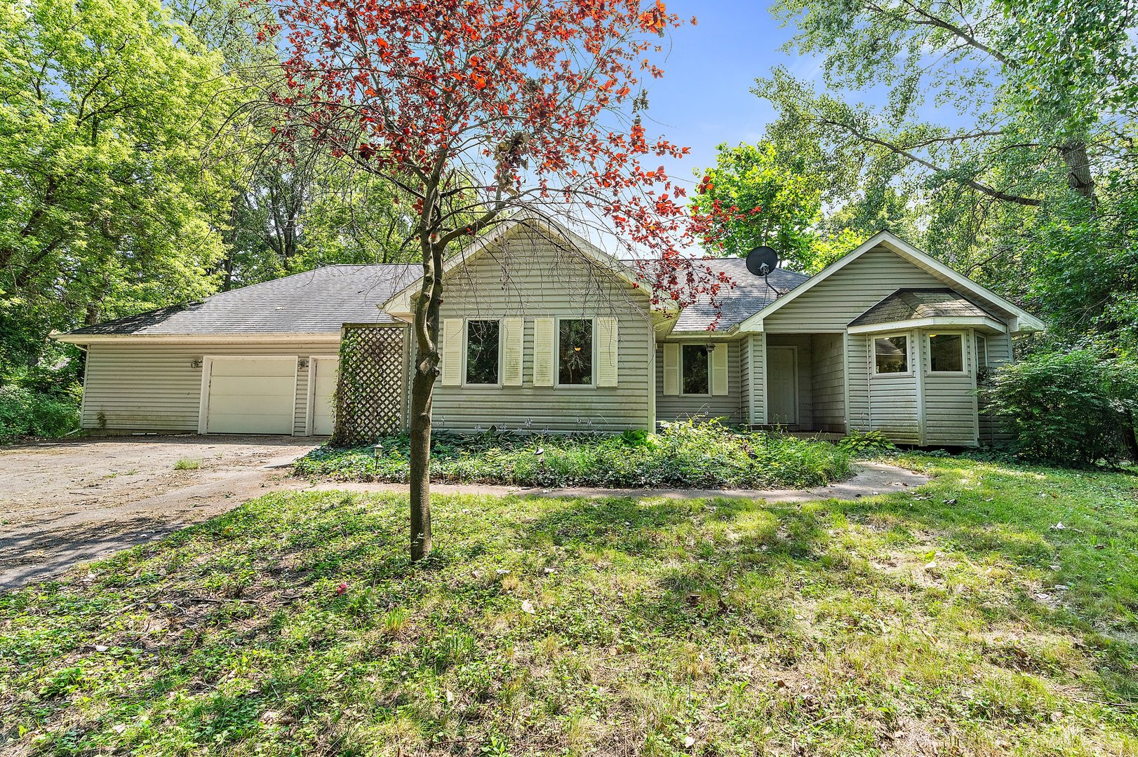 18707 Stevens Road Marengo, IL 60152 - Photo 2 of 35 a front view of a house with a yard and garage