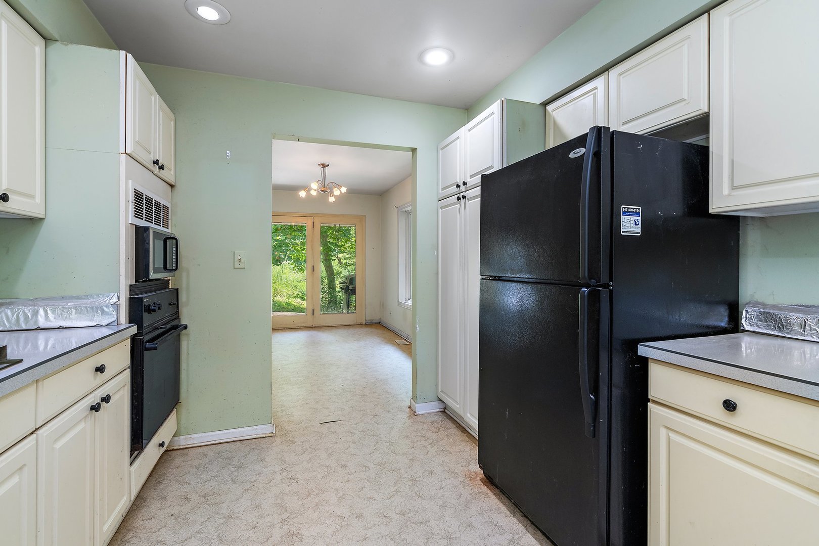 18707 Stevens Road Marengo, IL 60152 - Photo 10 of 35 a kitchen with stainless steel appliances granite countertop a refrigerator and a sink