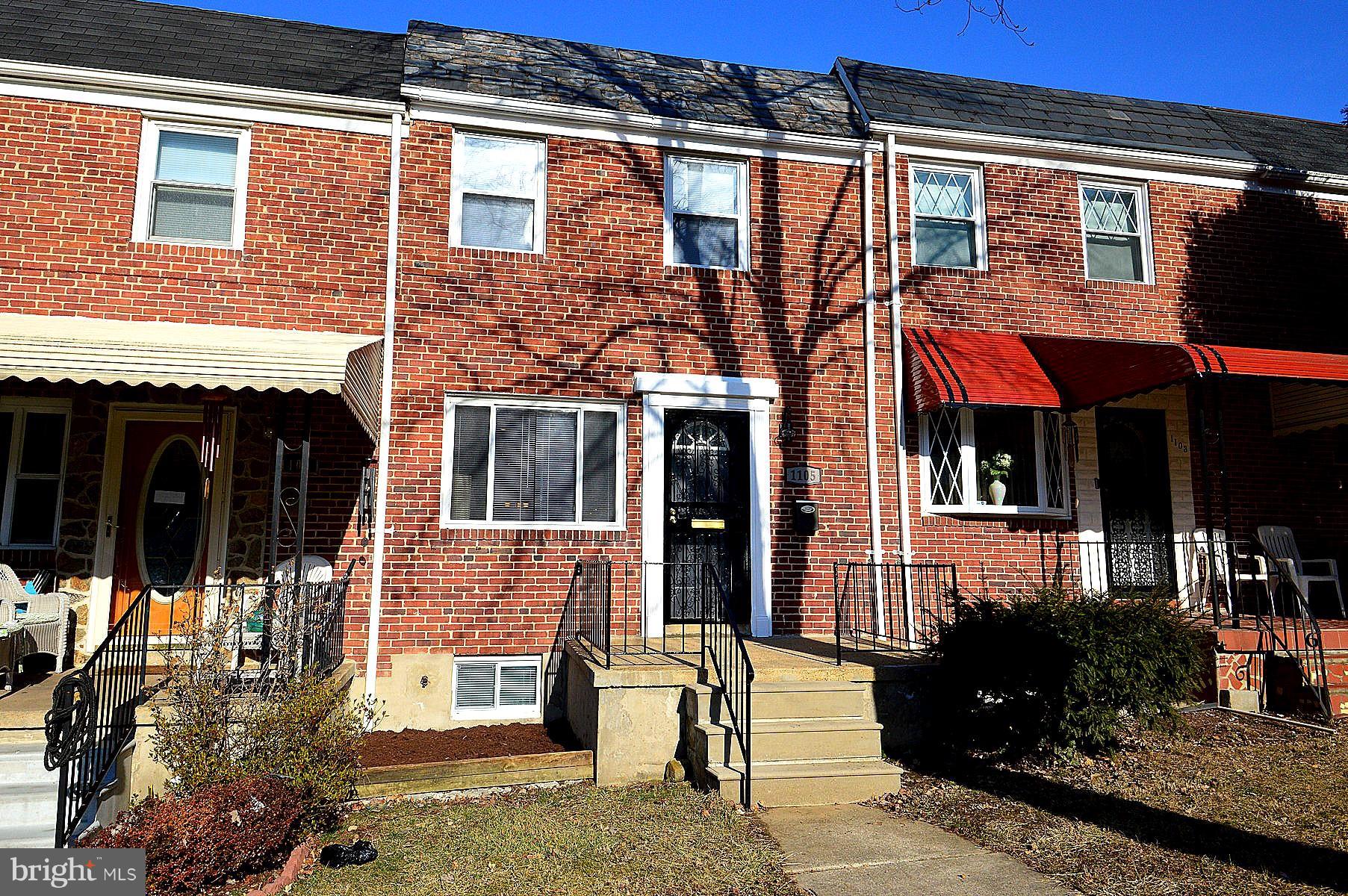 1105 Wedgewood Road Baltimore, MD 21229 - Photo 1 of 30 a front view of a house with a yard