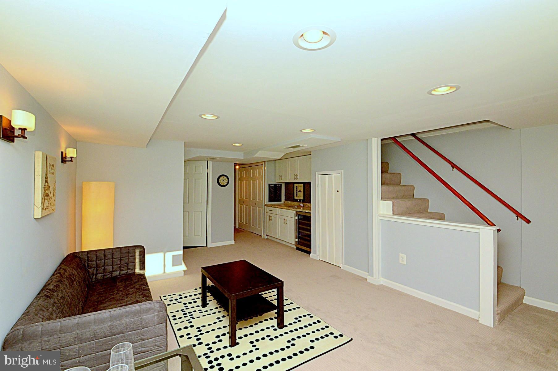 1105 Wedgewood Road Baltimore, MD 21229 - Photo 15 of 30 a living room with furniture and a rug