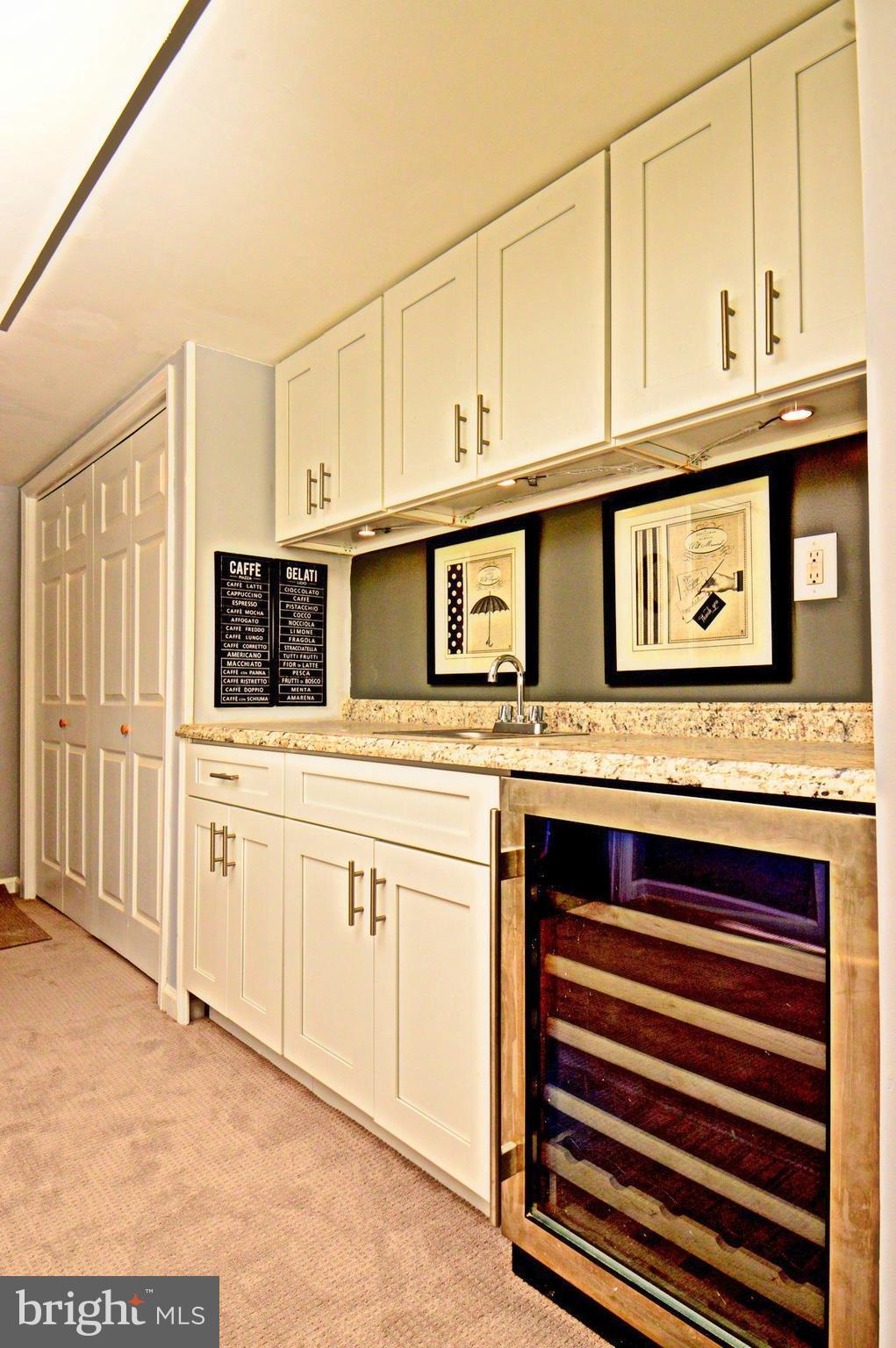 1105 Wedgewood Road Baltimore, MD 21229 - Photo 17 of 30 a kitchen with stainless steel appliances granite countertop white cabinets and a sink
