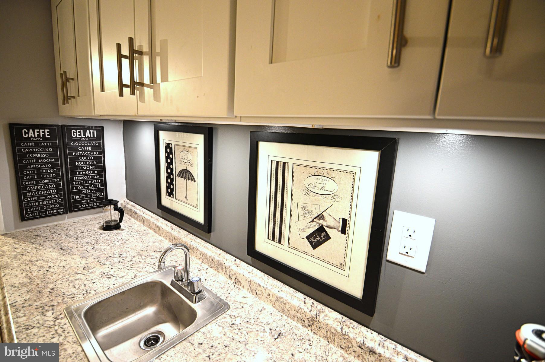 1105 Wedgewood Road Baltimore, MD 21229 - Photo 18 of 30 a bathroom with a sink and mirror