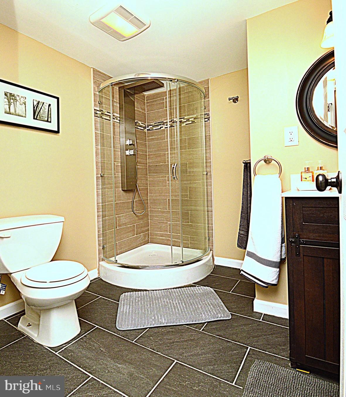 1105 Wedgewood Road Baltimore, MD 21229 - Photo 20 of 30 a bathroom with a toilet and a shower