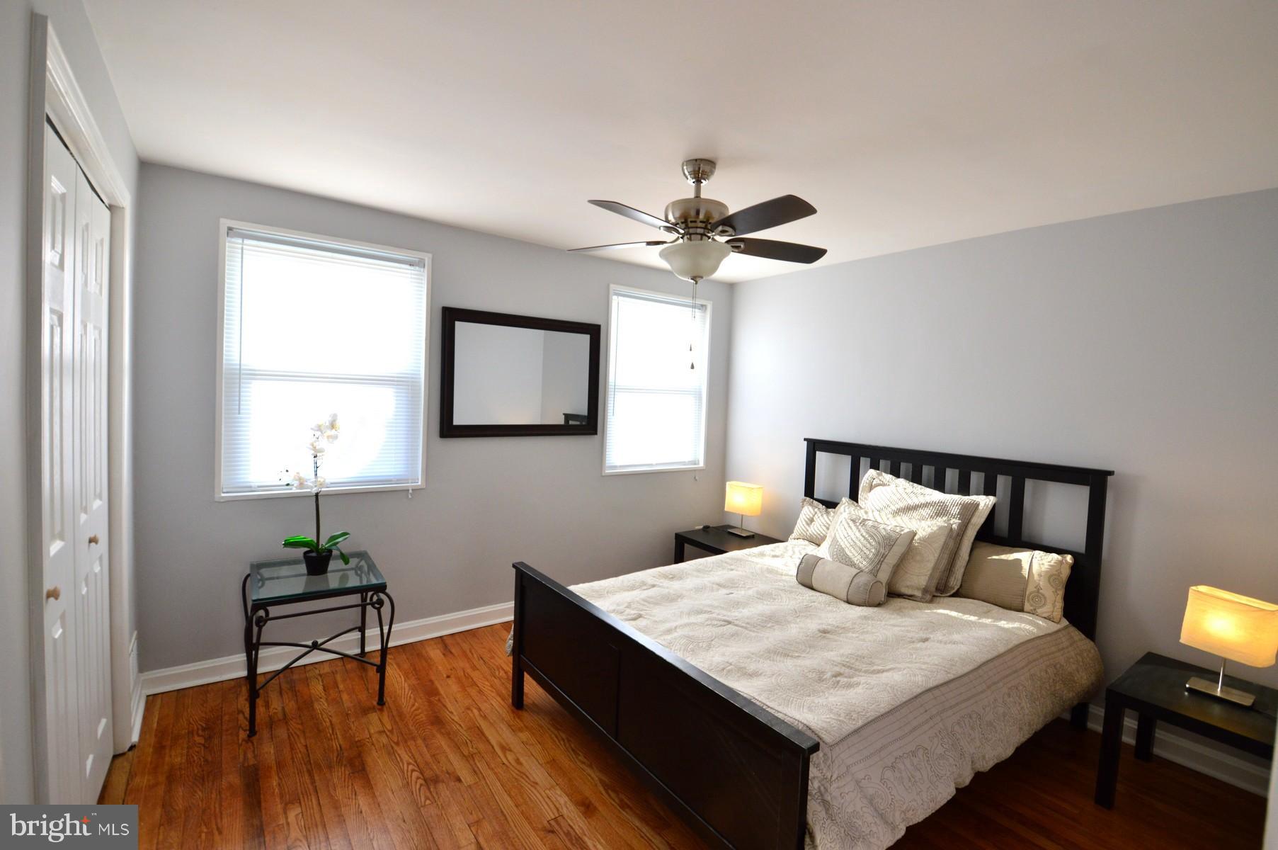 1105 Wedgewood Road Baltimore, MD 21229 - Photo 23 of 30 a bedroom with a bed and a chandelier