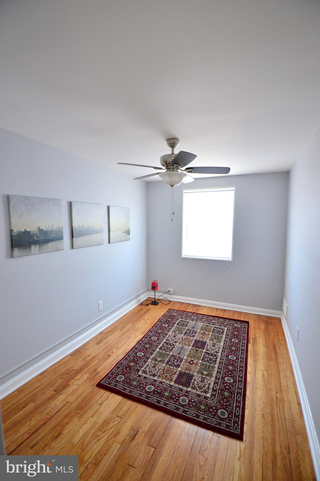 1105 Wedgewood Road Baltimore, MD 21229 - Photo 26 of 30 a view of a room with wooden floor and window