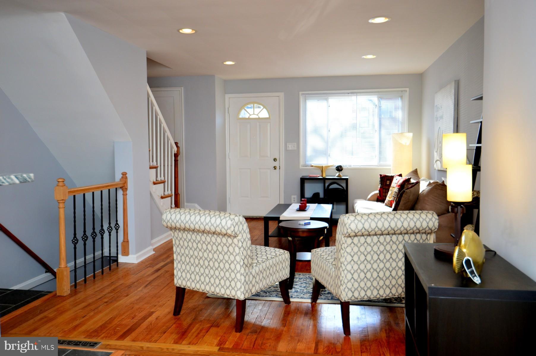 1105 Wedgewood Road Baltimore, MD 21229 - Photo 4 of 30 a living room with furniture and a wooden floor