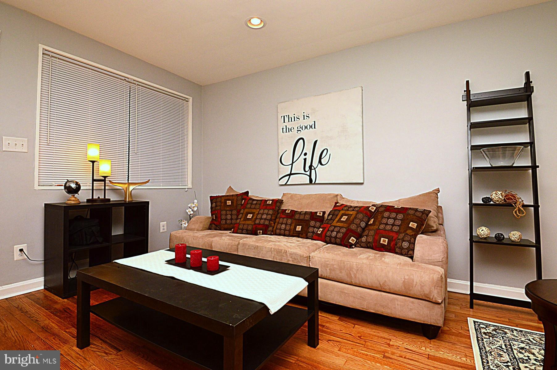 1105 Wedgewood Road Baltimore, MD 21229 - Photo 5 of 30 a living room with furniture and wooden floor