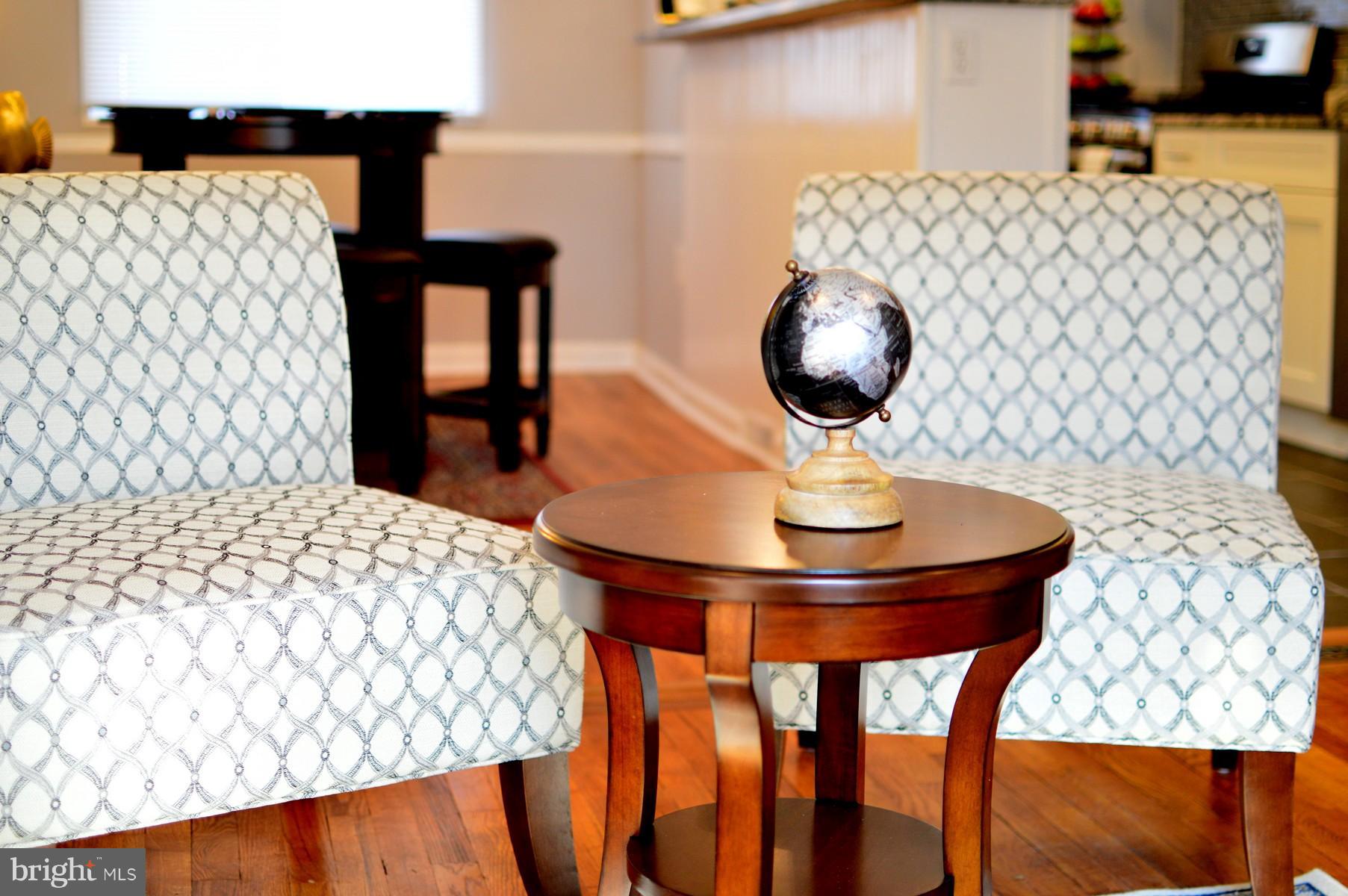1105 Wedgewood Road Baltimore, MD 21229 - Photo 6 of 30 a room with a table and chairs