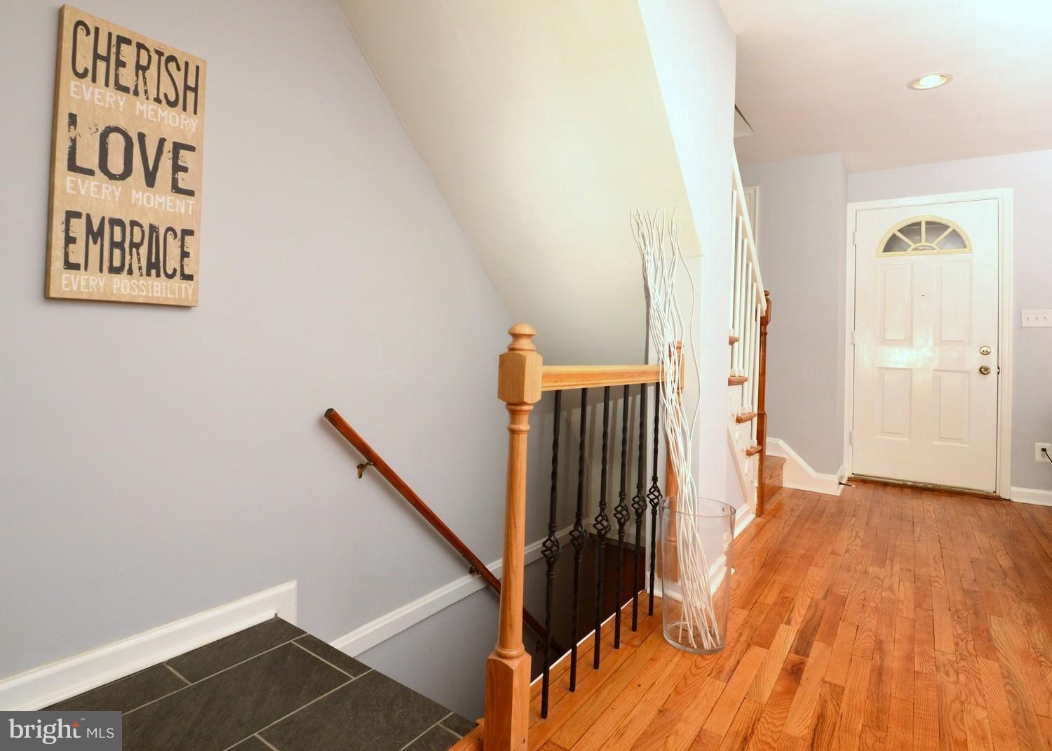 1105 Wedgewood Road Baltimore, MD 21229 - Photo 7 of 30 a view of a hallway with wooden floor and staircase