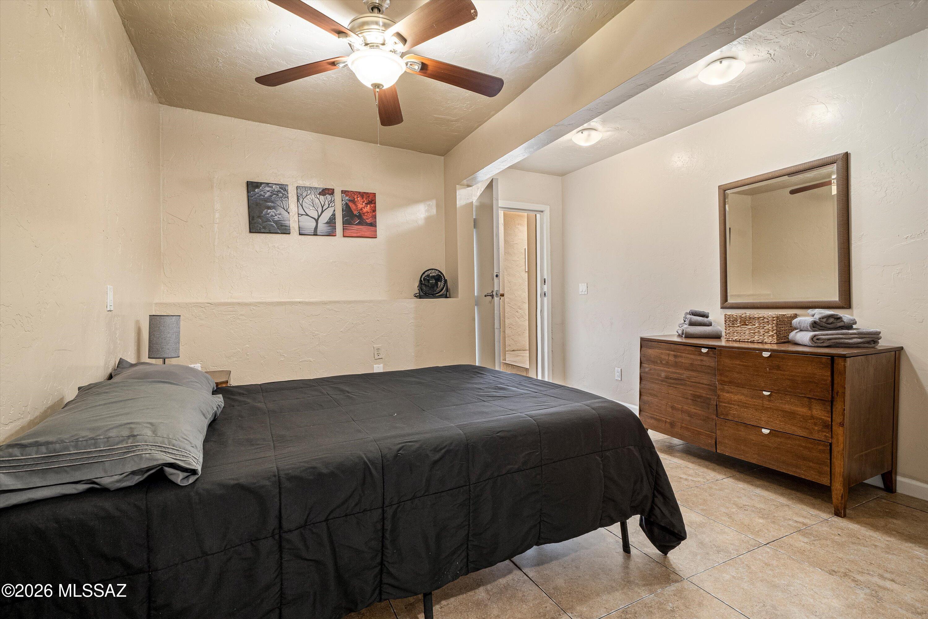 2619 East Prince Road Tucson, AZ 85716 - Photo 44 of 50 a bedroom with a bed and a dresser
