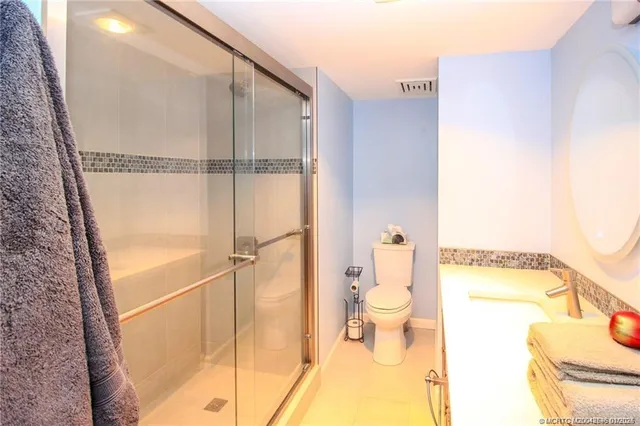 a bathroom with a sink and toilet