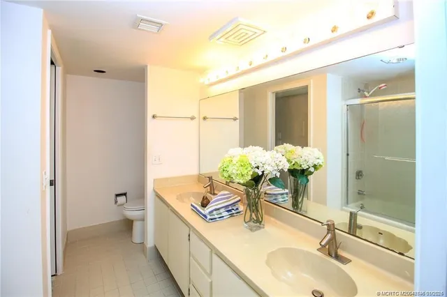 a bathroom with a sink a vanity and a mirror