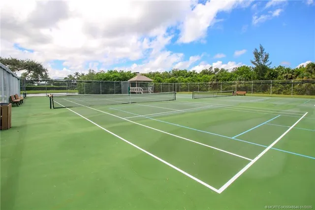a view of an outdoor space and tennis court