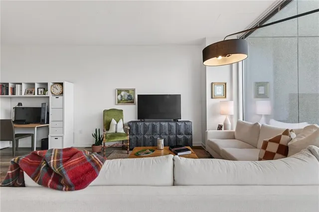 a living room with furniture and a flat screen tv
