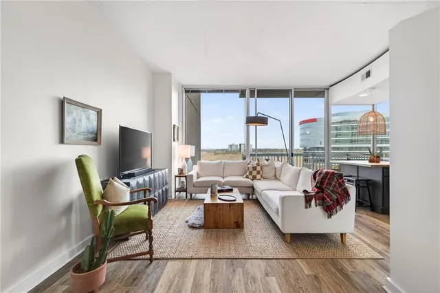 a living room with furniture and a flat screen tv