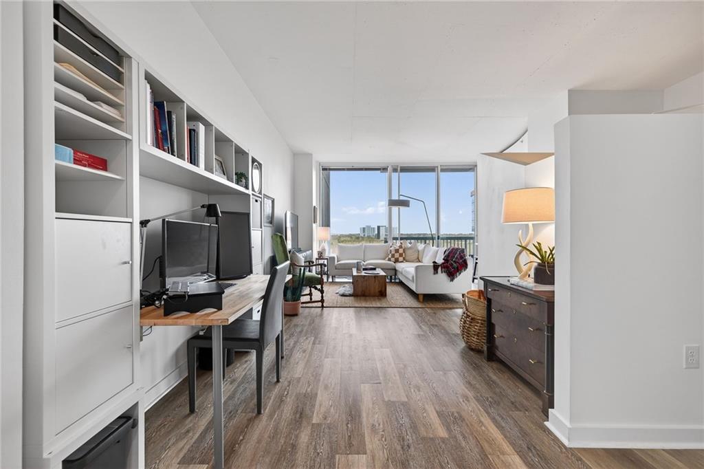 3300 Windy Ridge Parkway Southeast, Unit 1019 Atlanta, GA 30339 - Photo 17 of 37 a living room with furniture and a flat screen tv
