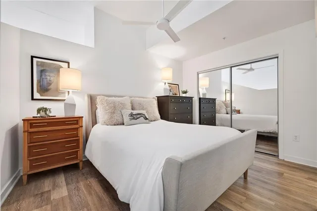 a bedroom with a bed and a mirror