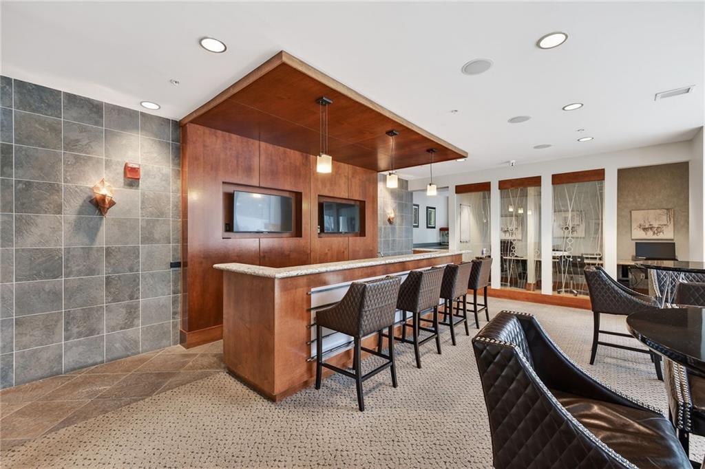 3300 Windy Ridge Parkway Southeast, Unit 1019 Atlanta, GA 30339 - Photo 23 of 37 a dining room with furniture and window