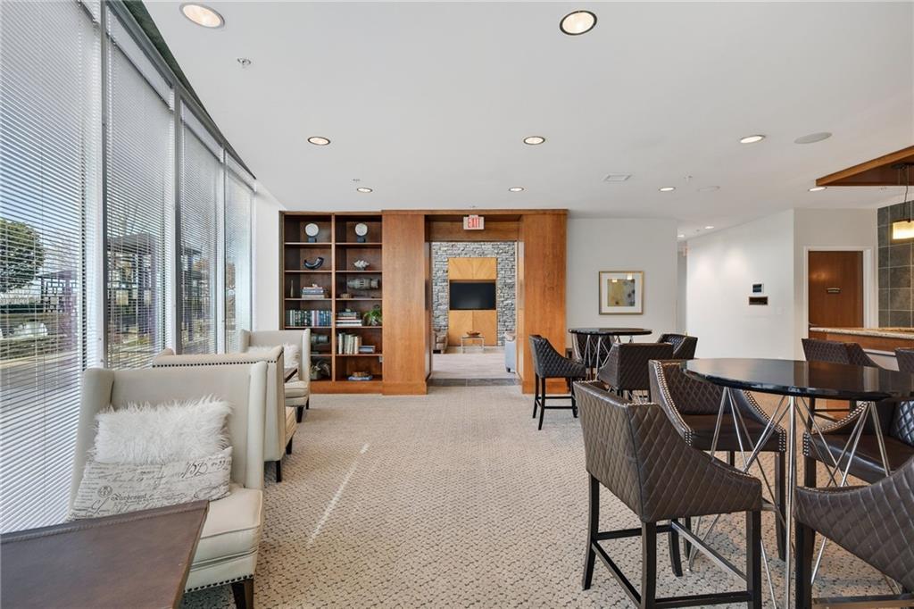 3300 Windy Ridge Parkway Southeast, Unit 1019 Atlanta, GA 30339 - Photo 24 of 37 a living room with furniture and large window