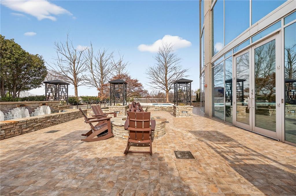 3300 Windy Ridge Parkway Southeast, Unit 1019 Atlanta, GA 30339 - Photo 28 of 37 a building outdoor space with patio furniture and a potted plant