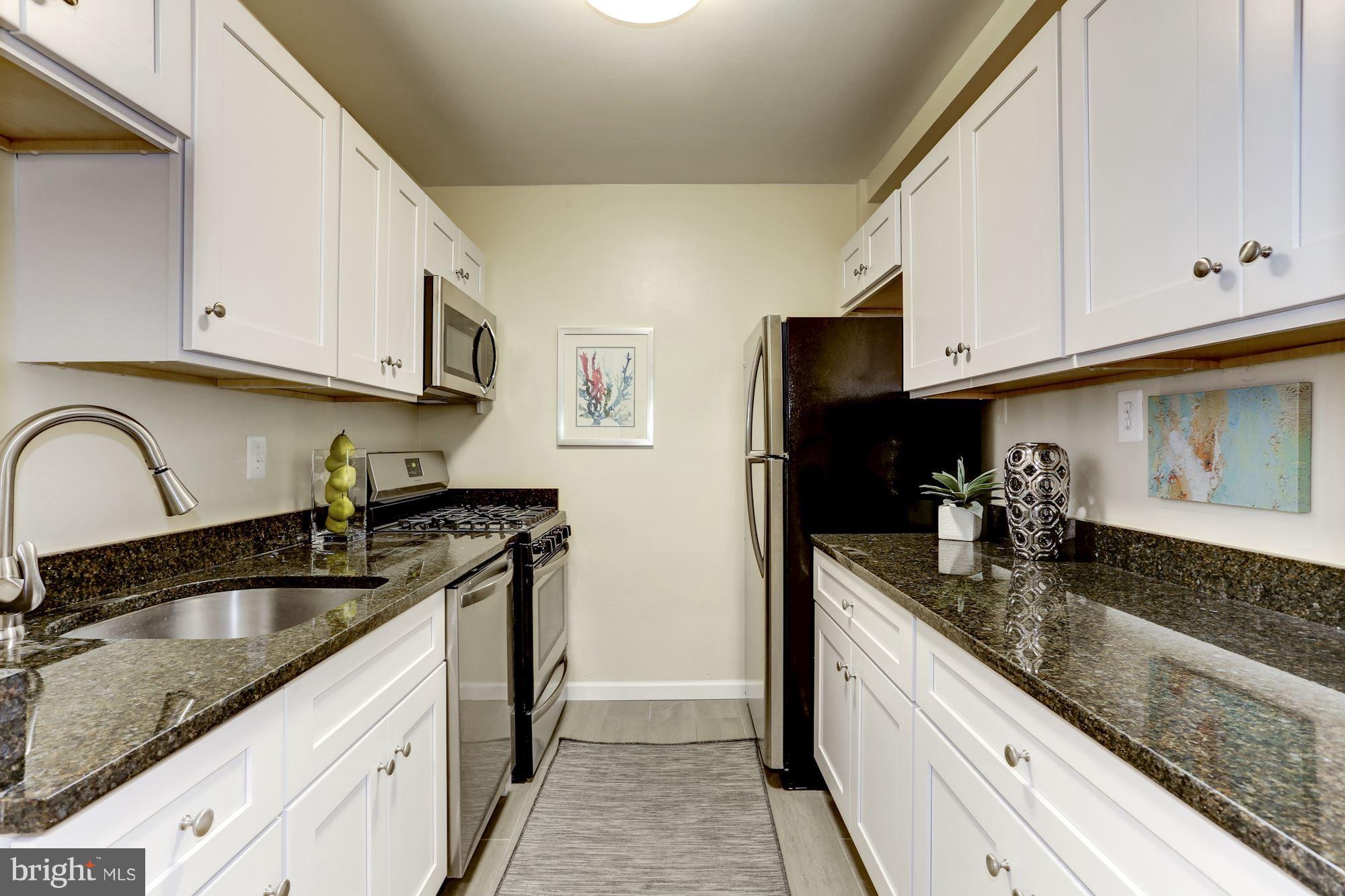 1880 Columbia Road Northwest, Unit 504 Washington, DC 20009 - Photo 9 of 30 New granite and stainless kitchen