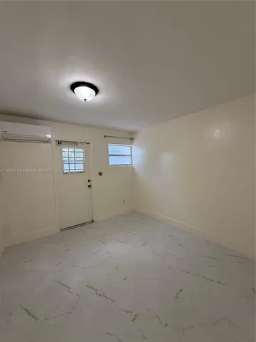 a bathroom with a toilet a sink and a mirror