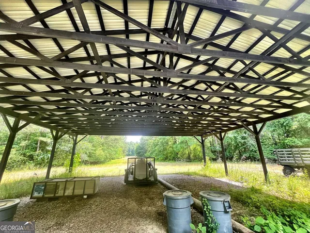 a view of yard with patio